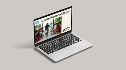 HP Sustainable Impact Report 2023 cover displayed on a laptop
