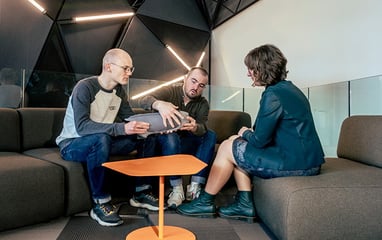 A group of people sitting together having a discussion